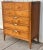 Stunning mid century modern dresser by Basic Witz. This chest features 5 dovetailed drawers with walnut fronts and banded...