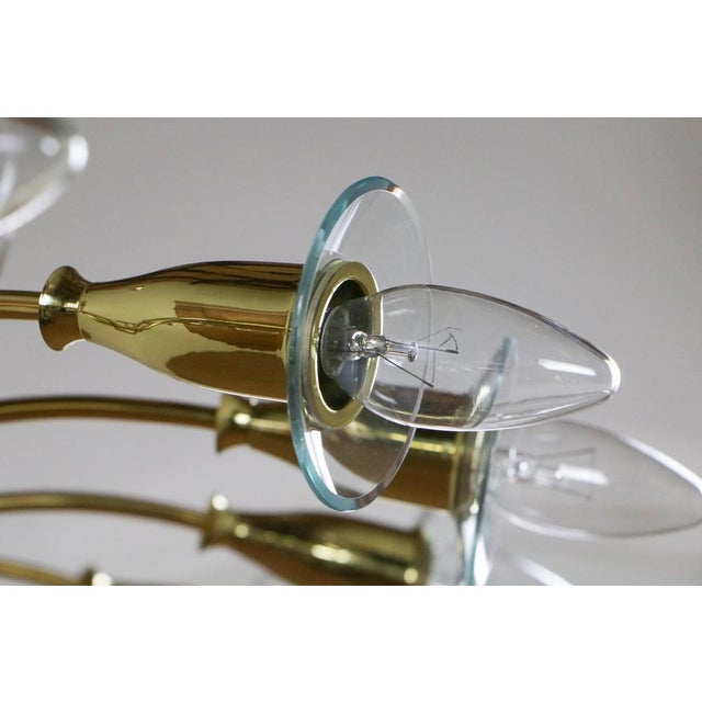 Magnificent chandelier designed by Angelo Lelli for Artiluce in 1950. Made of shiny brass with molated glass, this...