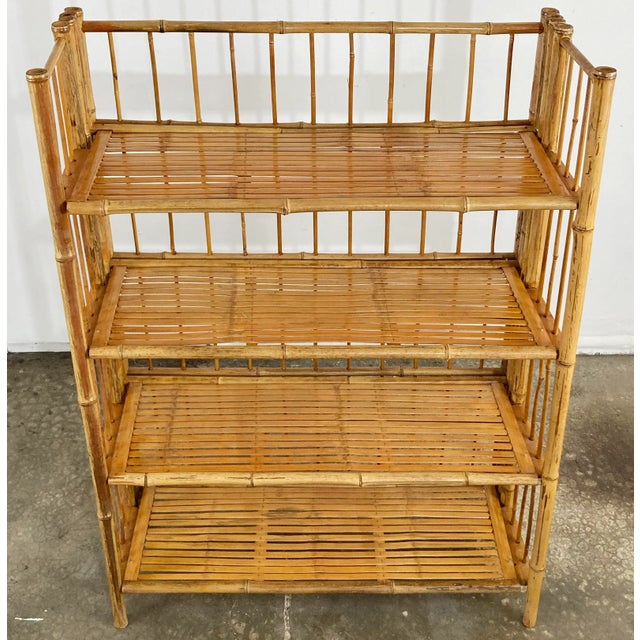 Vintage four-shelf unit made with striking scorched bamboo finish. Unit collapses to flat for efficient storage. Age wear....