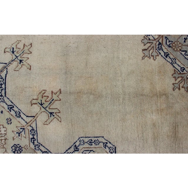 Champagne Early 20th Century Antique Turkish Oushak With Geometric Motifs in Champagne Field and Accent Blue For Sale - Image 8 of 12