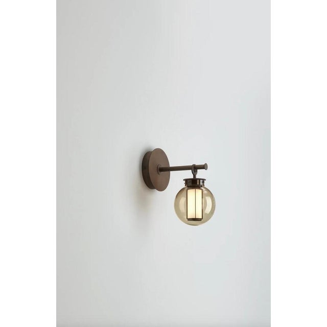 Neri and hu bai a di di bronze-transparent glass diffuser wall lamp for parachilna this collection is inspired by...