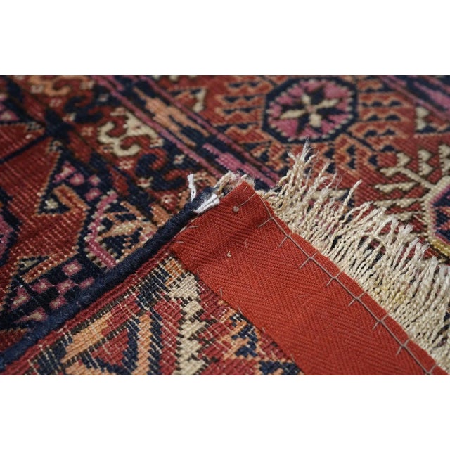 This nomadic galitcha (small rug) shows a totally characteristic red field, with three columns of eight quartered Tekke...