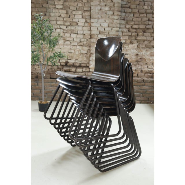 Original Galvanitas S23 chair, made in the Netherlands in the 1960s. Molded dark Pagholz seat and backrest on a black...