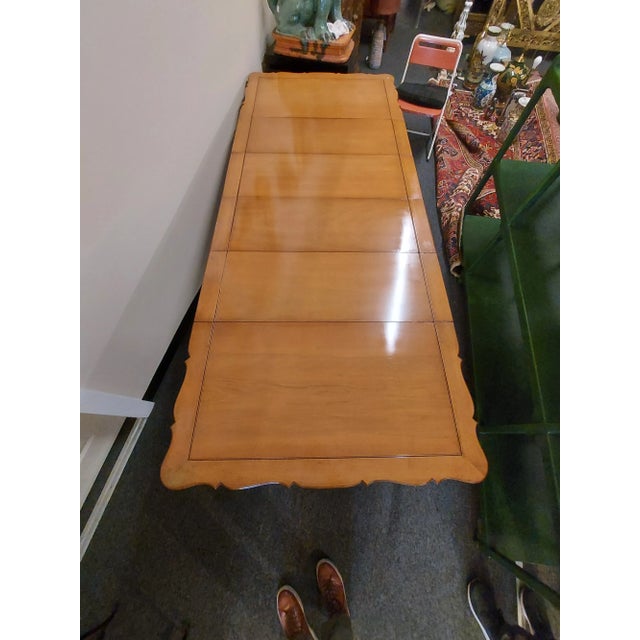 Vintage Louis the Xiv walnut dinging table has four leaves. Has great armolu on the legs and one side. When the leaves are...