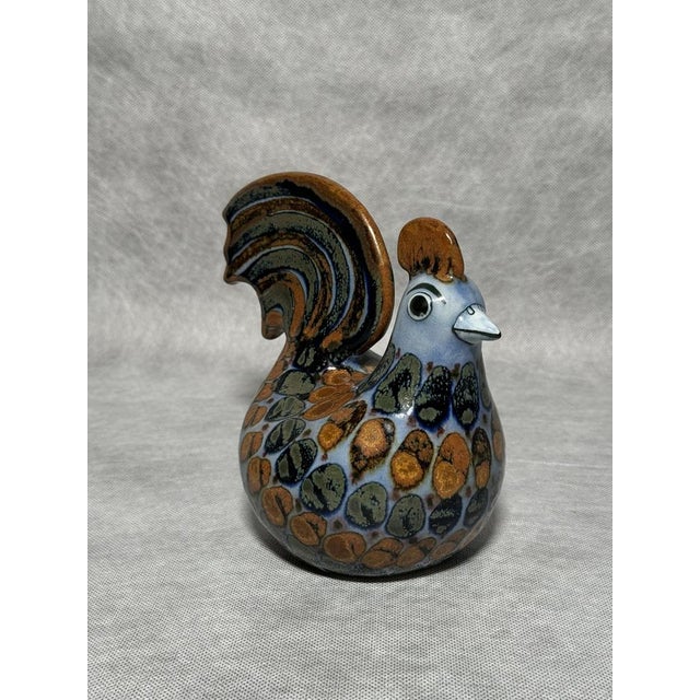 A large handmade talavera figure from the el palomar workshop, signed ke (ken edwards). Intricately painted feathers in...