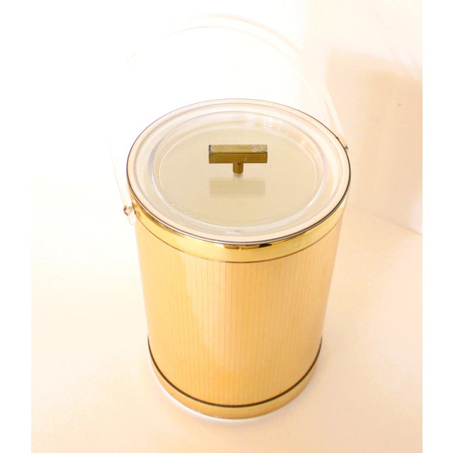 Elevate your bar cart with this stunning Hollywood Regency style mirrored gold tone ice bucket by the highly sought after...