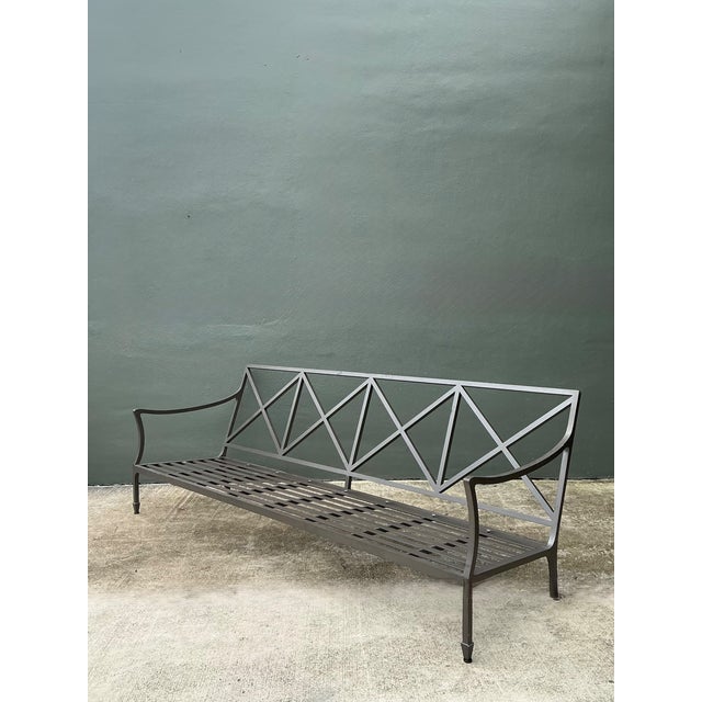 Vintage McKinnon and Harris “Beaufort” cast aluminum sofa offering a refined blend of sculptural design and outdoor...