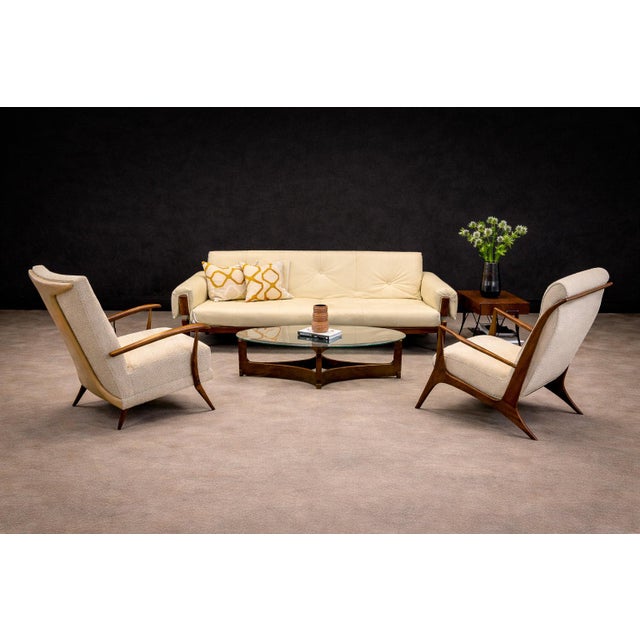 Designed as the “MP-13” model, this sofa reflects the disciplined material dialogue characteristic of Brazilian modern...