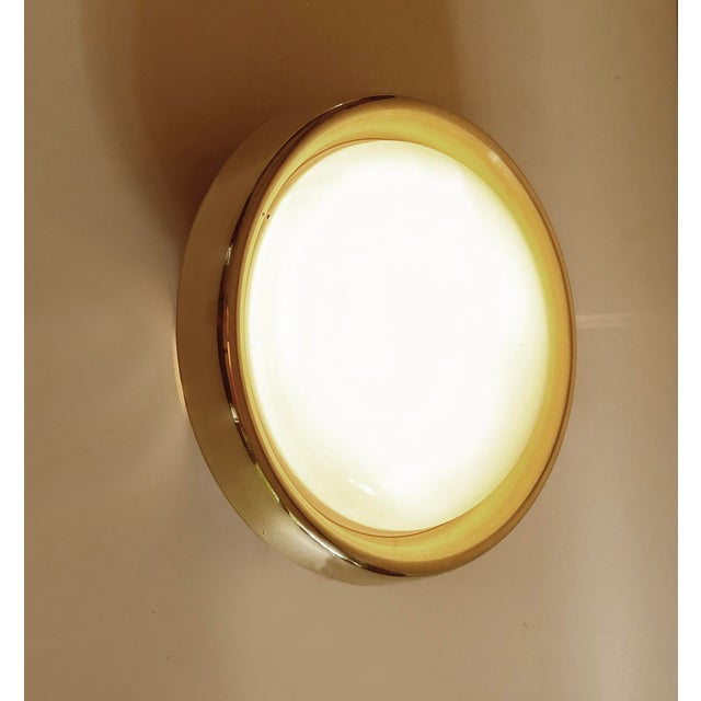 Vintage embeddable Limburg sconce or ceiling light, brass frame, opaline glass insert, the base has movable brackets to...