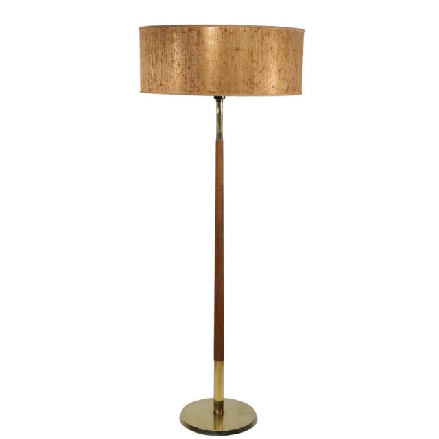 Chic Mid Century floor lamp, circa 950/1960's, design attributed to Gerald Thurston. The lamp features a cast brass base,...