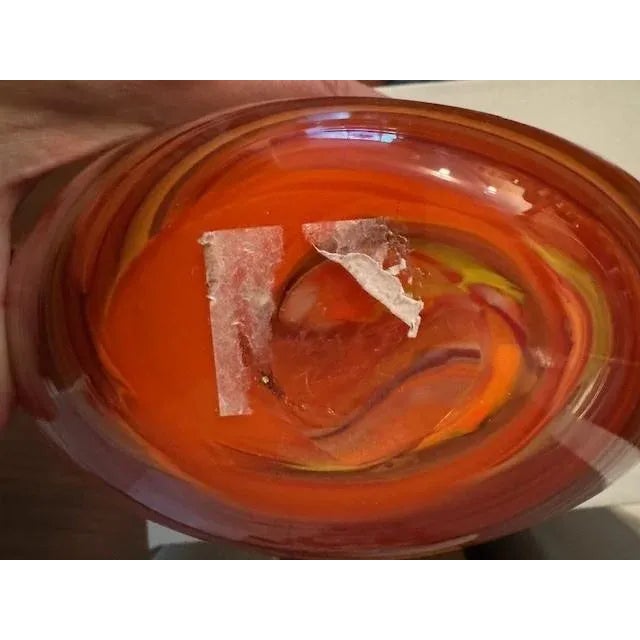 Caleb Simon signed round flat vase in orange hues. Siemon & Salazar has been designing and producing hand blown glass...