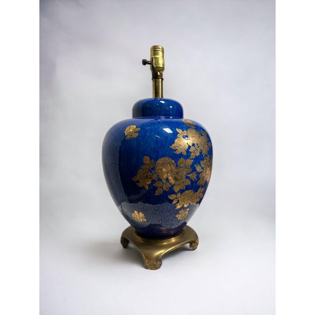 This lovely table lamp is a perfect blend of history and art, featuring a bright blue lacquer finish that is reminiscent...