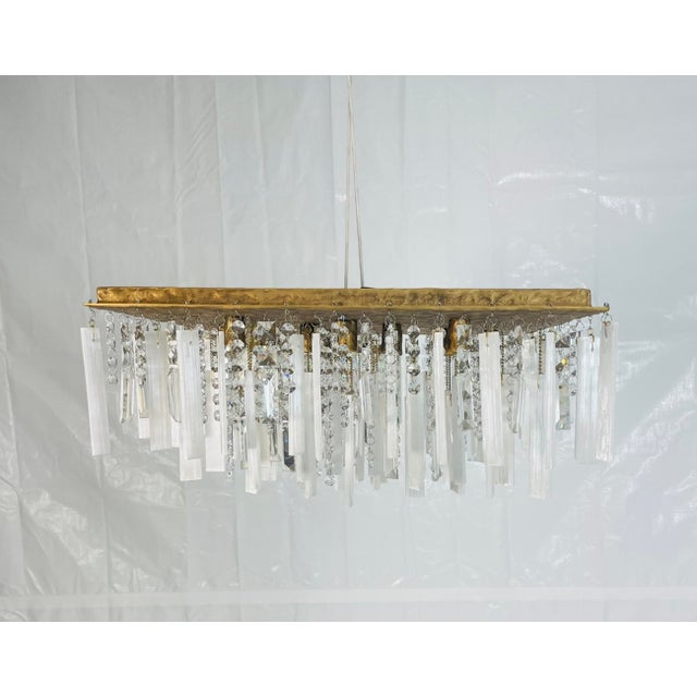 Elevate any luxury interior with the “Abu Dhabi” Flushmount Chandelier by Hous of Aurah, an opulent ceiling fixture that...