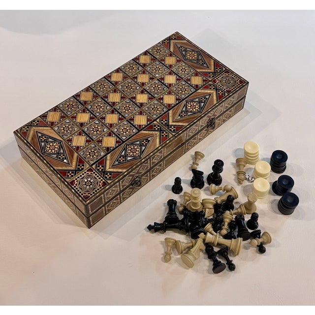 Handcrafted backgammon and chess set from Damascus, expertly inlaid with natural mother of pearl. Created using fine...