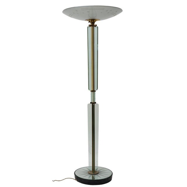 Floor lamp in grinded glass and mirrored glass, with base in wood and structure in brass. Designed by Luigi Brusotti in...