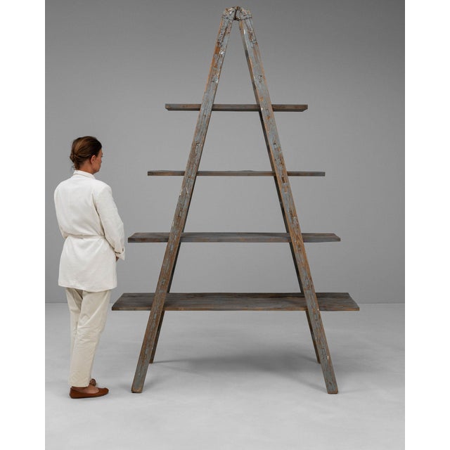 This piece carries genuine presence, its gray weathered wood immediately setting the tone for the piece. Originating in...