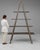 This piece carries genuine presence, its gray weathered wood immediately setting the tone for the piece. Originating in...