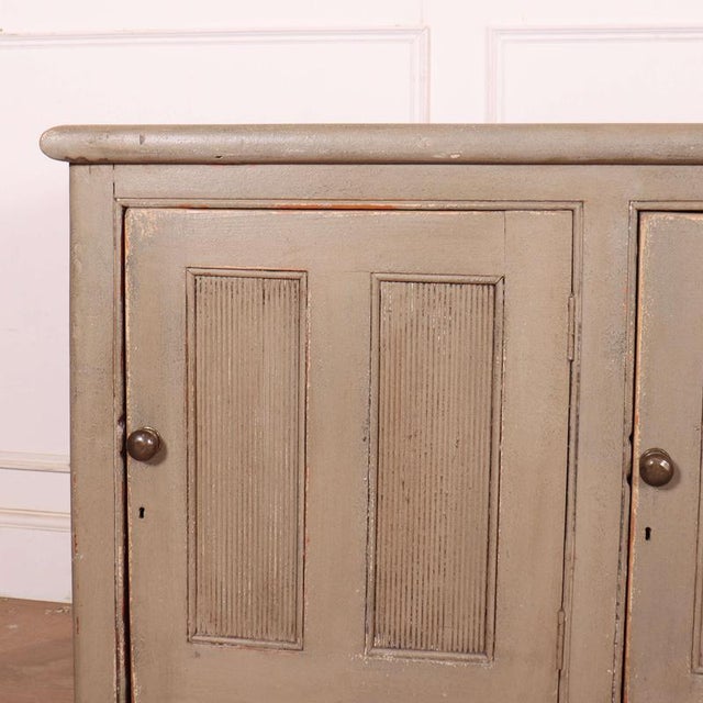 19th C English painted 3 door pine dresser base. 1860. Dimensions:W: 172cm (67.7")H: 89cm (35")D: 49cm (19.3") This piece...