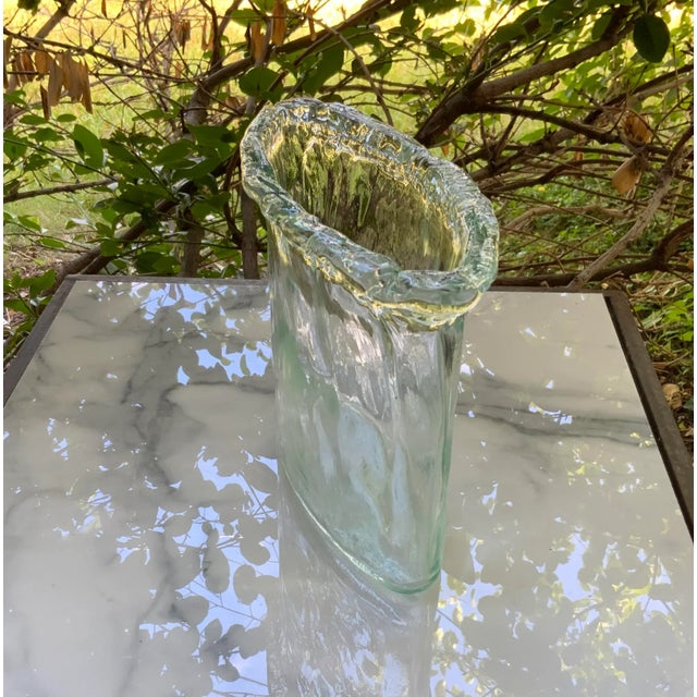 Heavy pale green lettuce-edged glass vase. Oblong shaped.