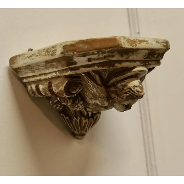 Winged Angel, Weathered Wall Bracket This is a well weathered piece, the bracket is made in hard plaster with a very worn...