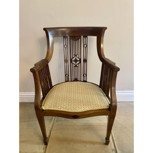 Outstanding quality antique Edwardian mahogany inlaid desk chair, having an outstanding quality mahogany inlaid shaped...