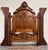 This is a beautifully carved late-Victorian Eastlake style full sized bed crafted in solid walnut with striking flame...