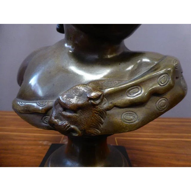 Bronze bust of the child Bacchus, with medal patina, after Auguste Moreau. The base bears the inscription ''A. Moreau''. I...