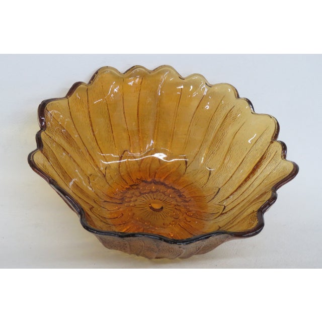 This beautiful Sunflower Shaped Bowl is made of glass. This lovely Bowl has a wonderful warm Amber color throughout the...