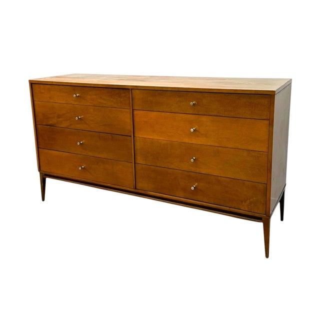 This authentic 1950s mid-century modern eight-drawer double dresser is an iconic piece from Paul McCobb’s breakthrough...