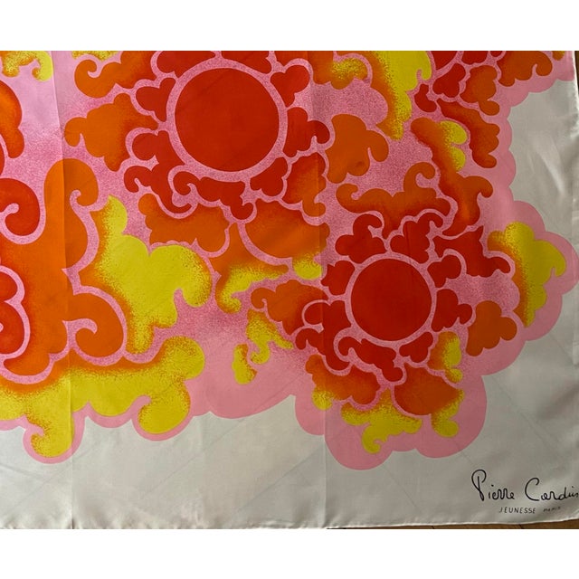 Pierre Cardin silk scarf, 1980 This delightful scarf, with its vibrant colors, features stylized red, orange, and yellow...