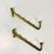These are a great find. From the 1940s we have a pair of metal wall mounted hooks that feature four stacking notches and a...