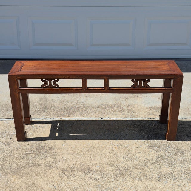 This is a traditional Asian style carved elm wood bench that measures 44” long, 11.25” deep, and 19.5” tall. It can be...