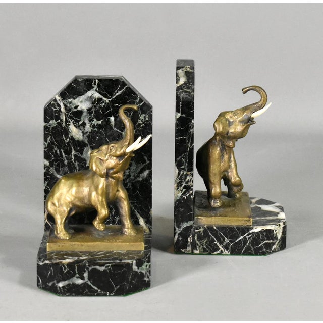 Pair of french art deco bookends signed h fady in bronze a delightful pair of bronze and marble bookends that are finely...