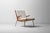 Lounge chair designed by Peter Hvidt and Orla Møgaard-Nielsen during the 1950s in Denmark. The frame is constructed from...