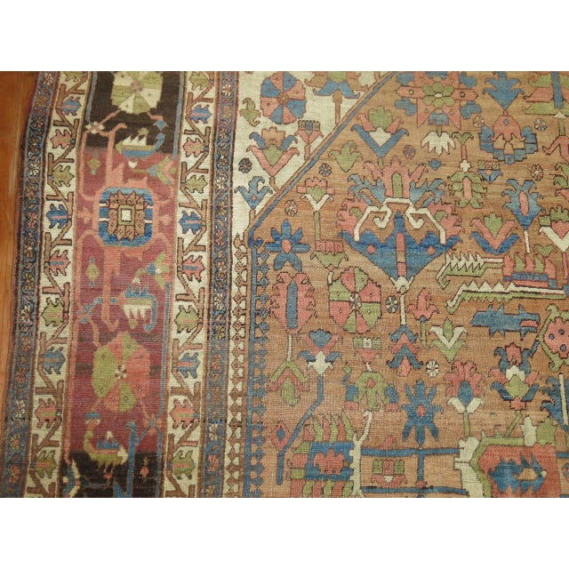 An early 20th century one of a kind in rustic tones. Pretty browns, light blue, green, and mustard dominant accents....