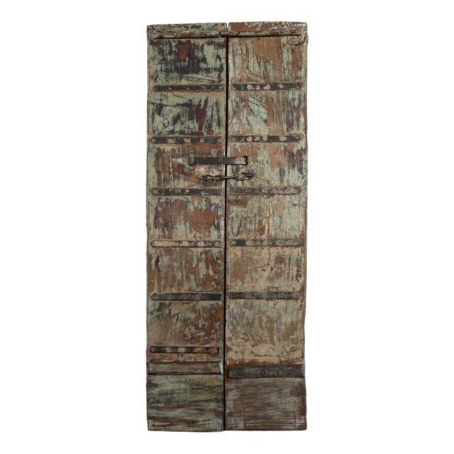 Discover the charm of this antique arched door, crafted from solid teak wood and featuring a rustic aged white finish....