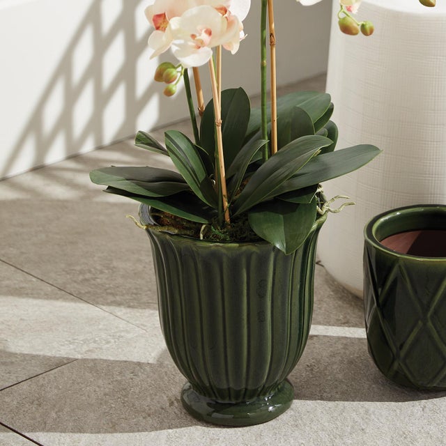 This set of earthenware pots are designed for the outdoors, but are equally as beautiful indoors. From the depth of the...