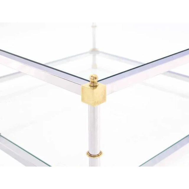 Glass polished chrome and brass Mid-Century Modern square two-tier coffee table. Measures: 37 x 37.