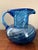 A beautiful blue hand blown glass pitcher with swirl pattern. No chip or cracks, this pitcher can also serve as a lovely...