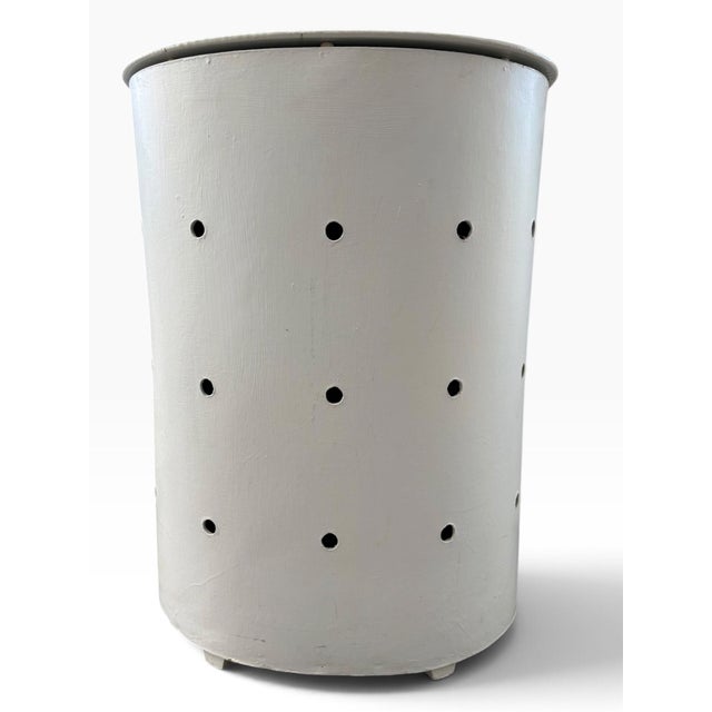 Distinctive vintage Mid-Century Modern hamper crafted from wood and finished in a soft pale blue-white paint. The tapered...