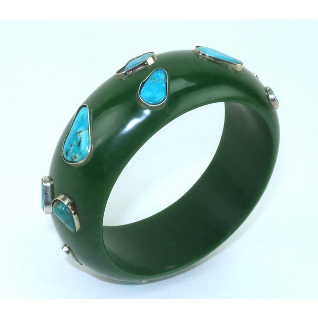 Chunky & Chic! Vintage dark green resin bangle bracelet embellished with inlaid turquoise stones set in silver. From an...