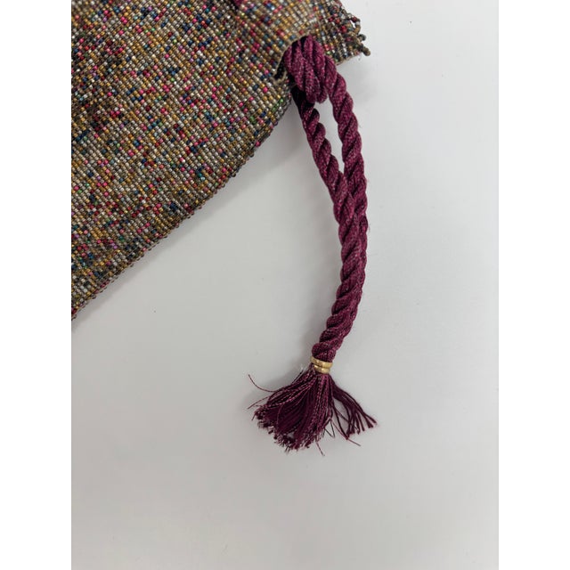 This is a super fun colorful micro beaded bag. It has a high quality draw string. The bag itself is made out of multicolor...