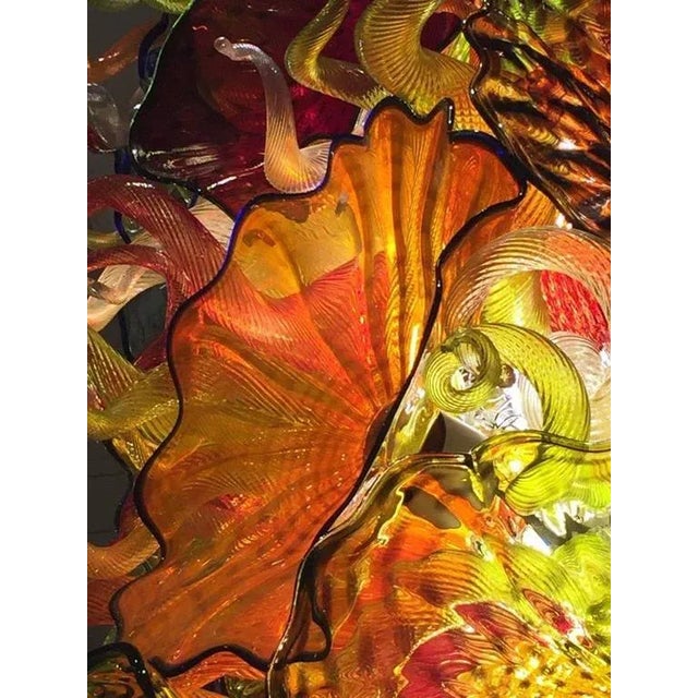 Hand blown glass chandelier. This incredible chandelier is made up of numerous colors. The beauty of this chandelier is...