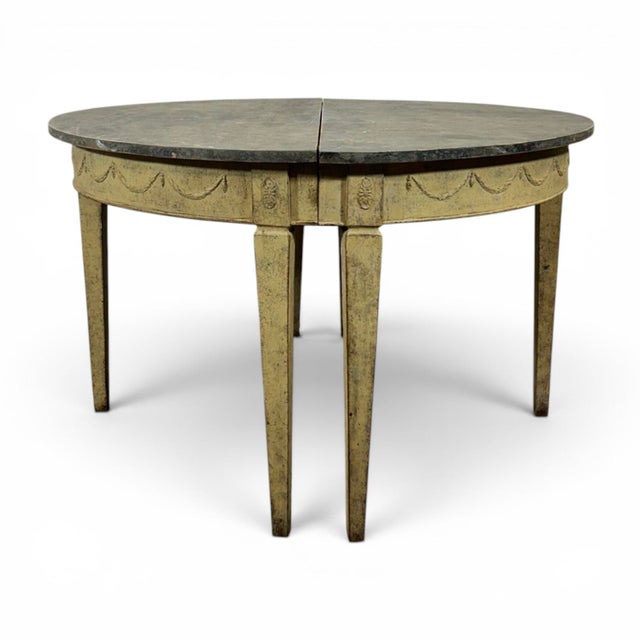 Beautiful, antique pair of Swedish demi lune console table. The top is black with marble imitation’s and the lower part is...