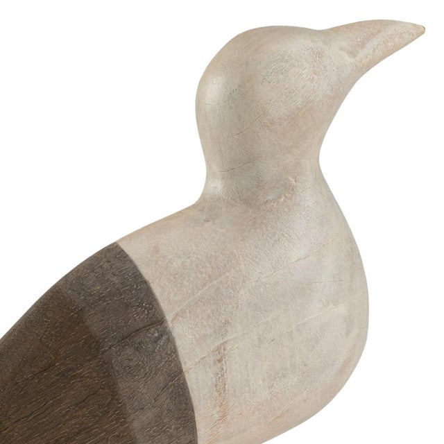 Create a coastal atmosphere by adding shorebird to your decor. This 15" sea gull is crafted in hand stained mango wood....