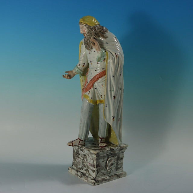 Ralph Wood Staffordshire Pottery pearlware figure with a religious theme which features a standing figure of Saint...