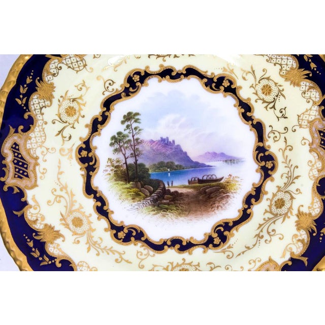 This is a beautiful antique shaped circular Coalport Named View porcelain cabinet plate signed E. Ball and dated 1891. The...