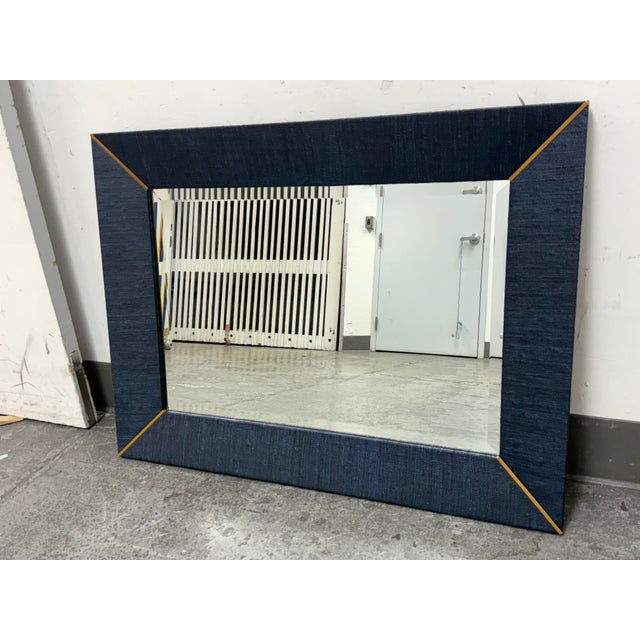 Design Plus Gallery presents a Navy Blue Linen Wrapped Driftway Mirror from Serena & Lily. The mirror is wrapped in blue...