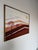 Beautiful vintage postmodern landscape painting featuring geometric layered hills, stylized trees, and warm earth tone...