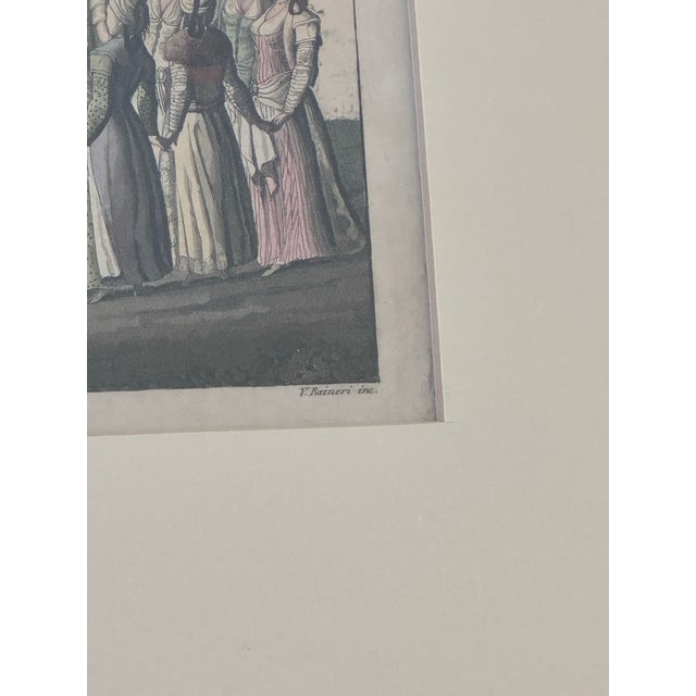 This captivating hand-tinted engraving, signed by artist F. Raineri, depicts an elegant Ottoman dance scene rich in...